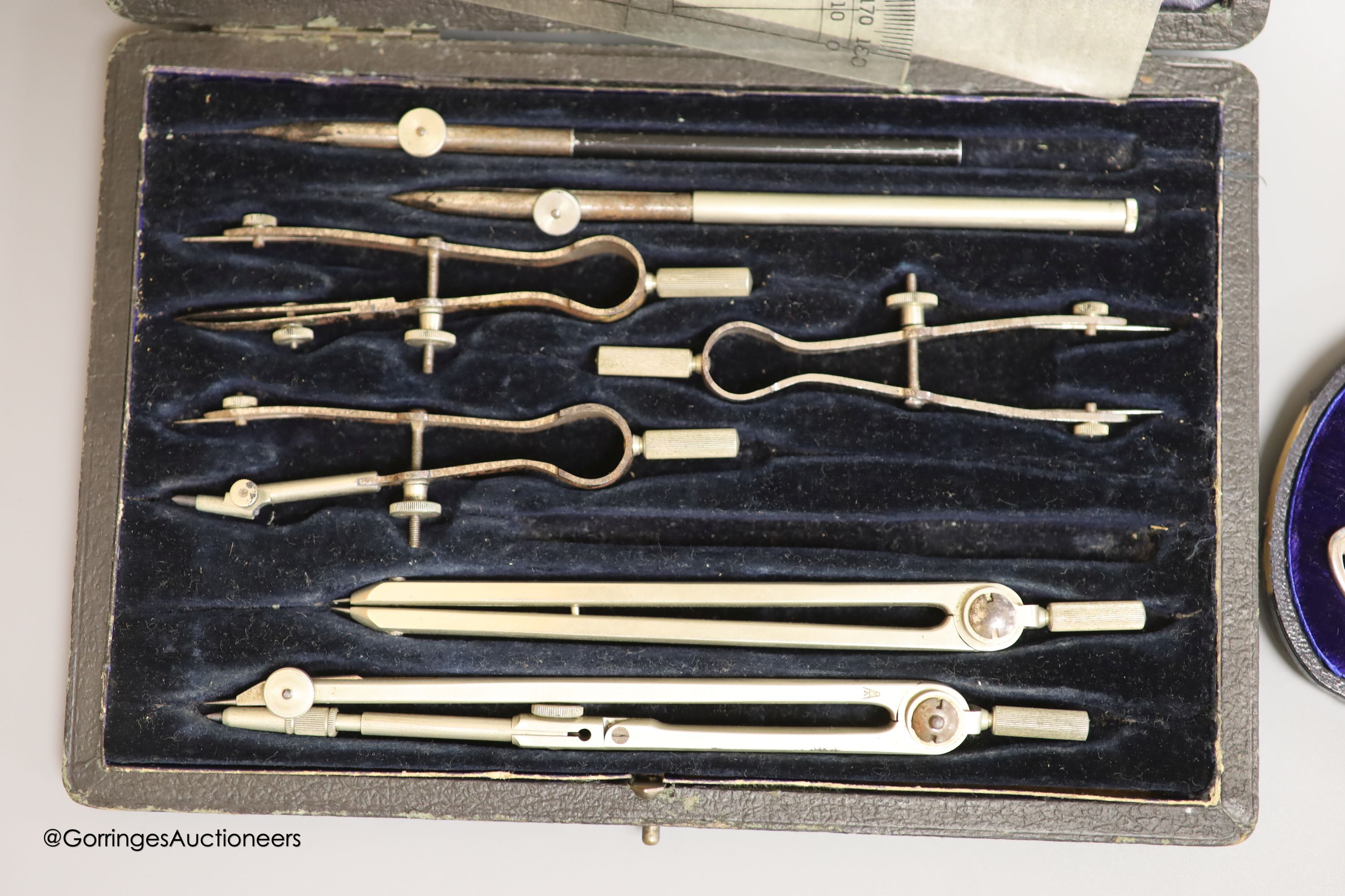 A cased Victorian silver christening spoon and fork, with pierced terminals, Jehoiada Alsop Rhodes, Sheffield, 1873 and a draughtsman's set.